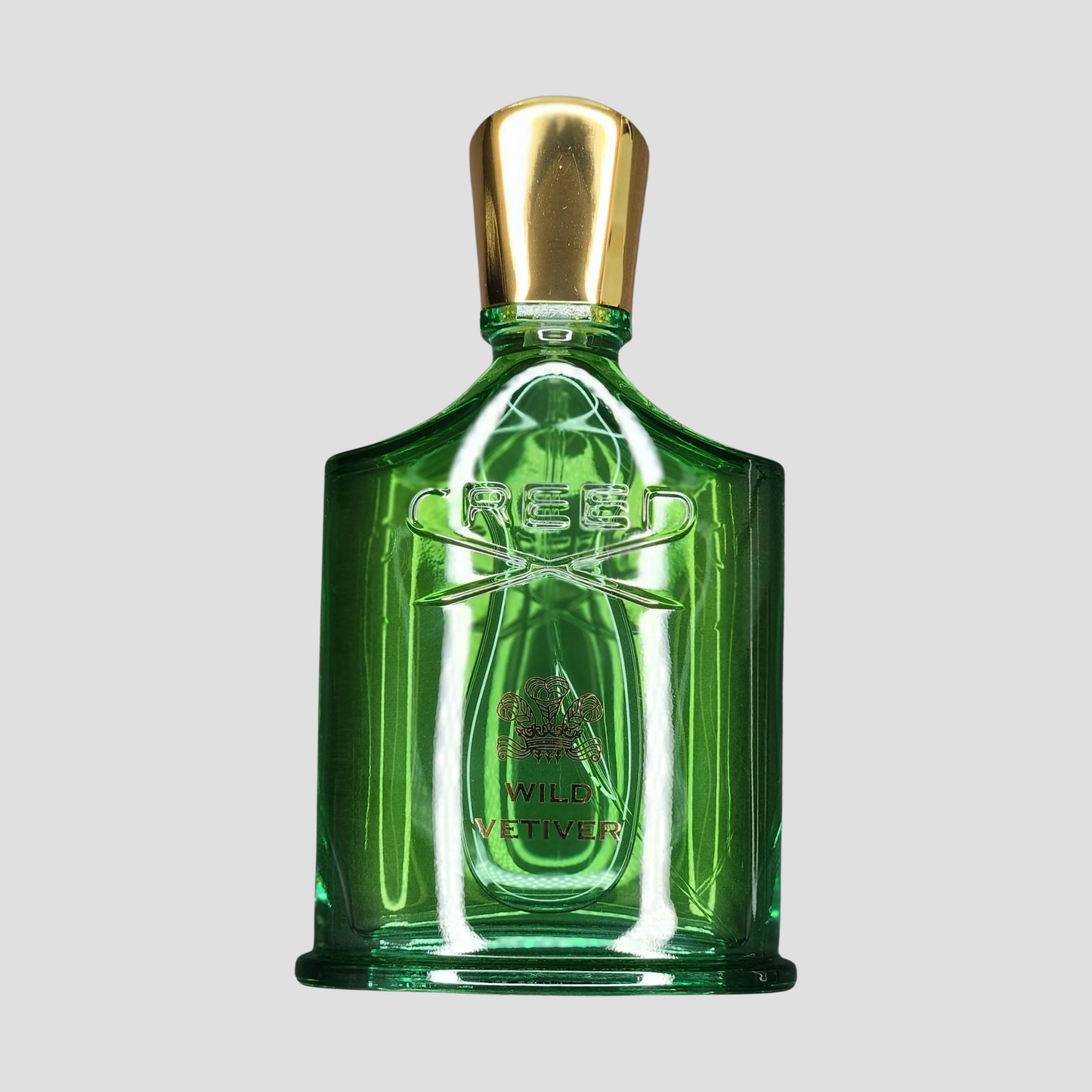 A bottle of Creed Wild Vetiver on a light grey background